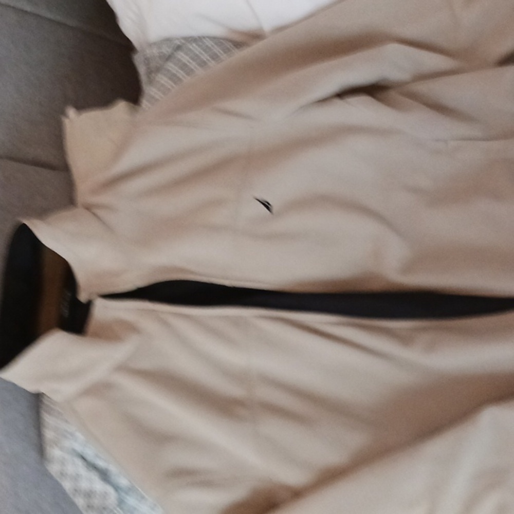 Nautica jacket tan and reversible to black.  Zipper front, flip collar
